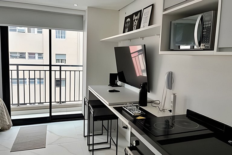 Studio com academia e coworking próx PUC (707)